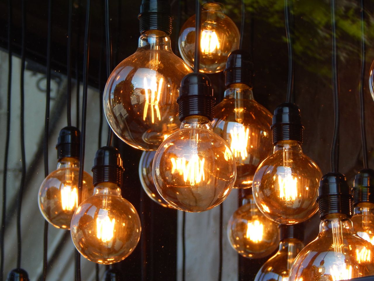 about-04 A captivating close-up of glowing vintage Edison light bulbs, creating a warm ambiance.